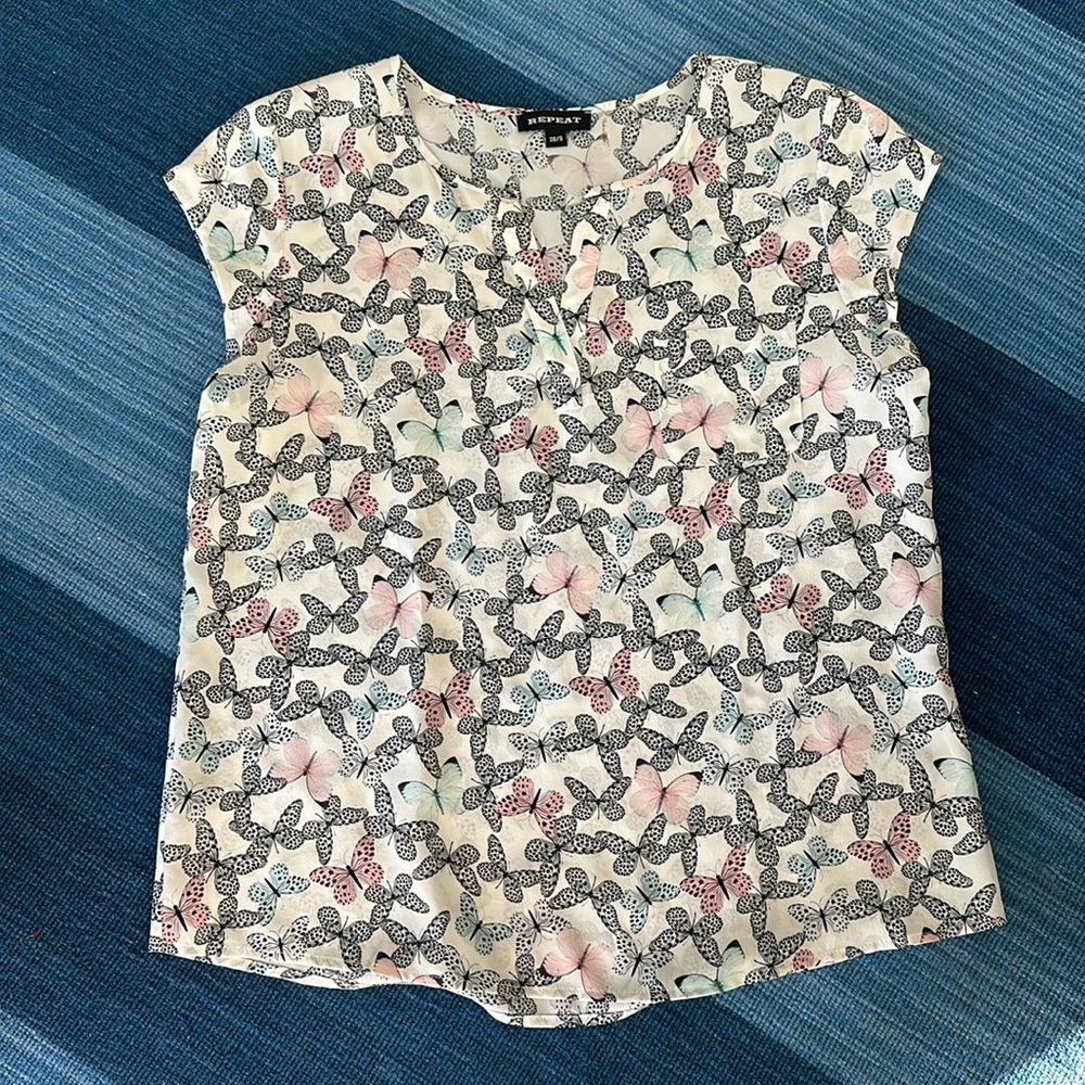 Short sleeve silk butterfly blouse.